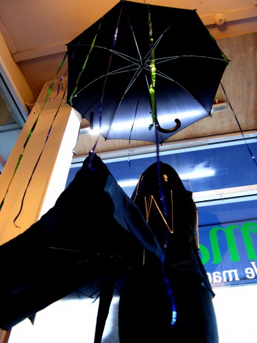 The underside of the bustle, showing the umbrella ribs supporting it.
