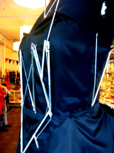Detail view of the bodice on our WoW window dress. It is black, and features external boning made from umbrella ribs.